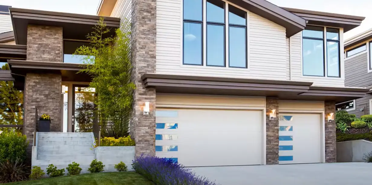 Professional technician repairing a garage door with precision tools, providing expert garage door repair services in Boca Raton.